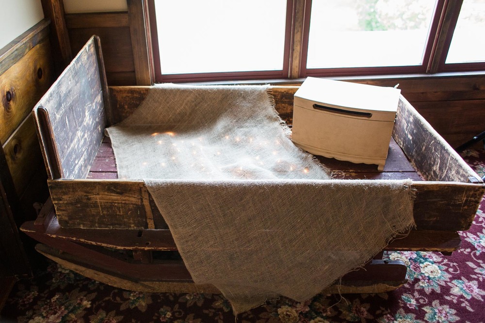 Here is your spot for gifts right by the door to the Chestnut Room. Who needs a gift table when you can have an antique wood sleigh like this?